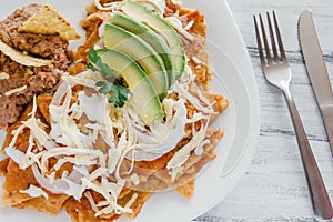 Chilaquiles rojos with chicken and avocado mexican food mexico breakfast photo