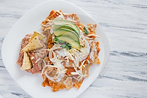 Chilaquiles rojos with chicken and avocado mexican food mexico breakfast photo