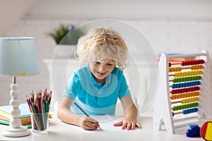 Child with abacus doing homework after school.