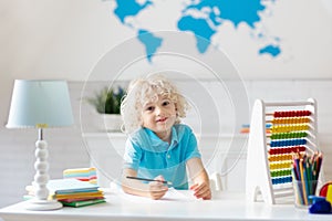 Child with abacus doing homework after school.