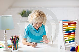 Child with abacus doing homework after school
