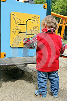 Child at the activity board