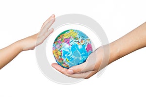 Child and Adult Holding a World Globe in Hands