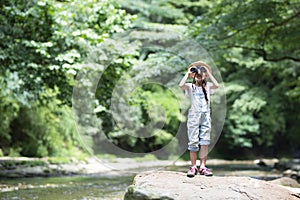 Child adventures in a mountain stream