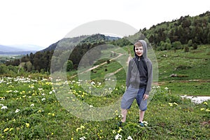 Child on alpine meadow of Lago-Naki plateau