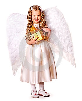 Child at angel costume holding gift box.