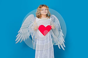 Child with angel wings hold paper heart. Symbol love and valentines day. Valentines day banner. Cute child with angel