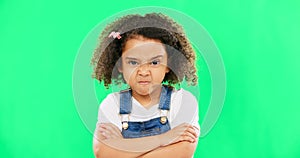Child, angry and face with arms crossed on green screen with attitude, problem or frustrated in studio. Black kid or