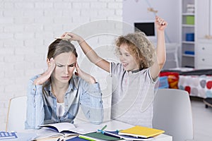 Child annoying his mother