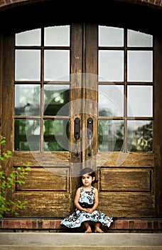 Child and antique door photo