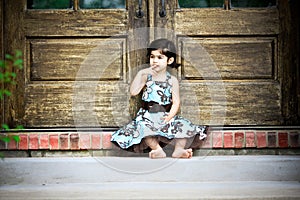 Child and antique door photo