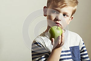 Child & apple.Little Boy with green apple.Health food.Fruits