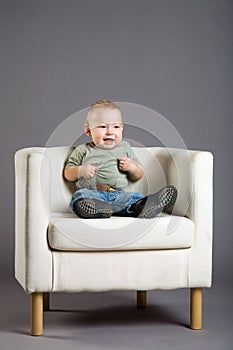 Child in armchair