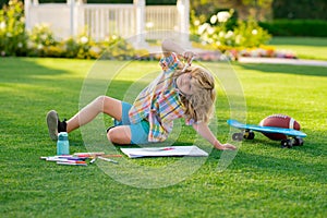 Child artist, kids crafts. School kids drawing in summer park, painting art. Little painter draw pictures outdoor.