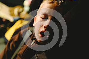 Child asleep in his extenuated car seat