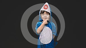 Child with baby shark costume