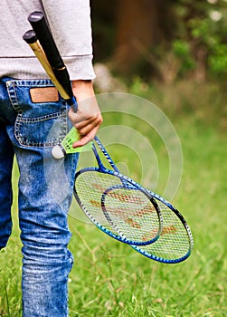 Child with badminton rackets