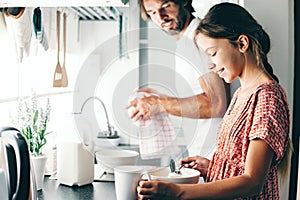 Child baking with parent