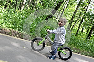 Child on balance bike