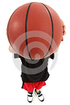 Child Basketball Player with Ball Over Face