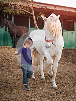 Child and bay horse in field