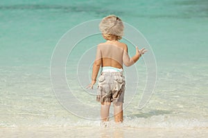 Child at the beach on a summer day