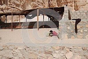 Child a bedouin drinks water