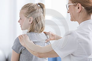 Child being given back massage