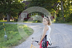 Child on bicycle on country road