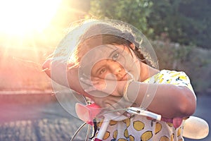 Child in a bicycle outdoors