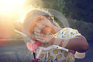 Child in a bicycle outdoors