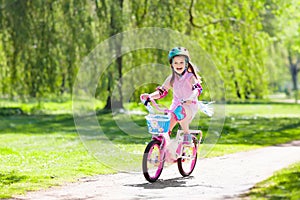 Child on bike. Kids ride bicycle. Girl cycling.