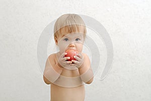 Child bitting tomato