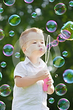 Child blow bubbles photo