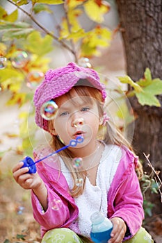 Child blowing bubbles