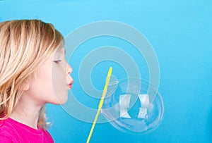 Child blowing bubbles