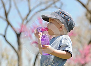 Child Blowing Soap Bubbles