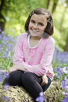 Child and bluebells