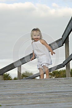 Child on boardwalk