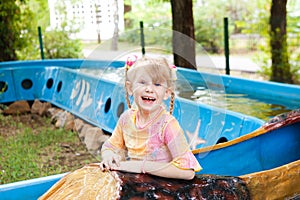 Child in the boat in the park