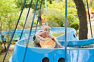 Child in the boat in the park