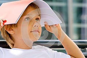 Child with book on his head photo
