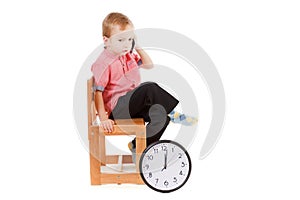 Child boss with clock and smart phone, time management concept isolated on white