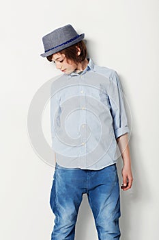 Child, boy and confidence for fashion in studio, cool clothing and attitude by white background. Male person, kid and