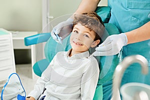 Child boy in the dental office smiling