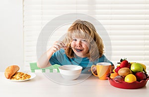 Child boy eating organic healthy food. Healthy vegetables with vitamins. Proper kids nutrition concept.