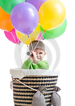 Child boy on hot air balloon isolated