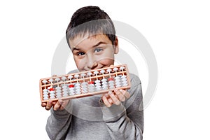 Child boy with Japanese traditional abacus soroban isolated on white background with clipping path