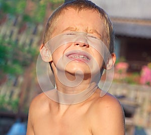 Child Boy making sore crying Faces showing Calf's Teeth Decay