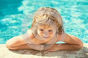 Child boy play in tropical resort. Children fun. Cute kid relaxing on swimming pool. Child having fun in summertime.